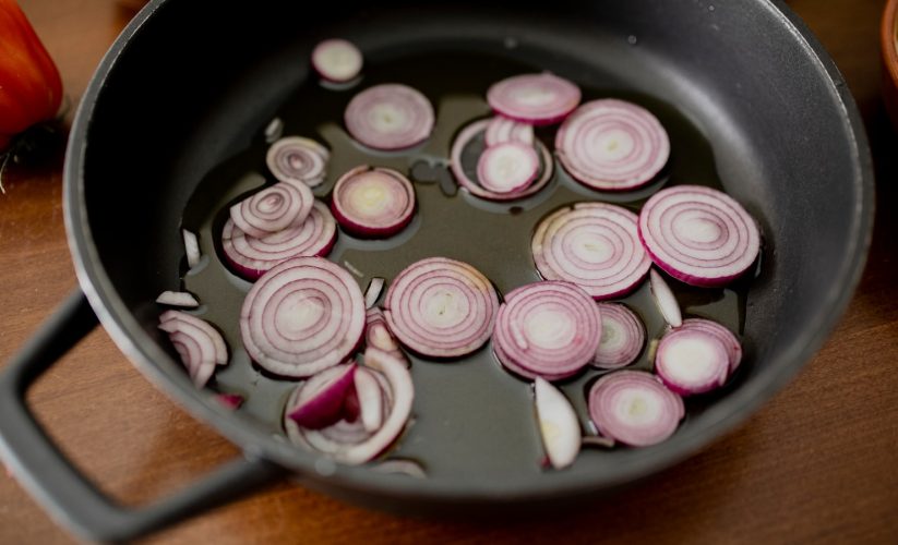 pink and white round candies on black round plate